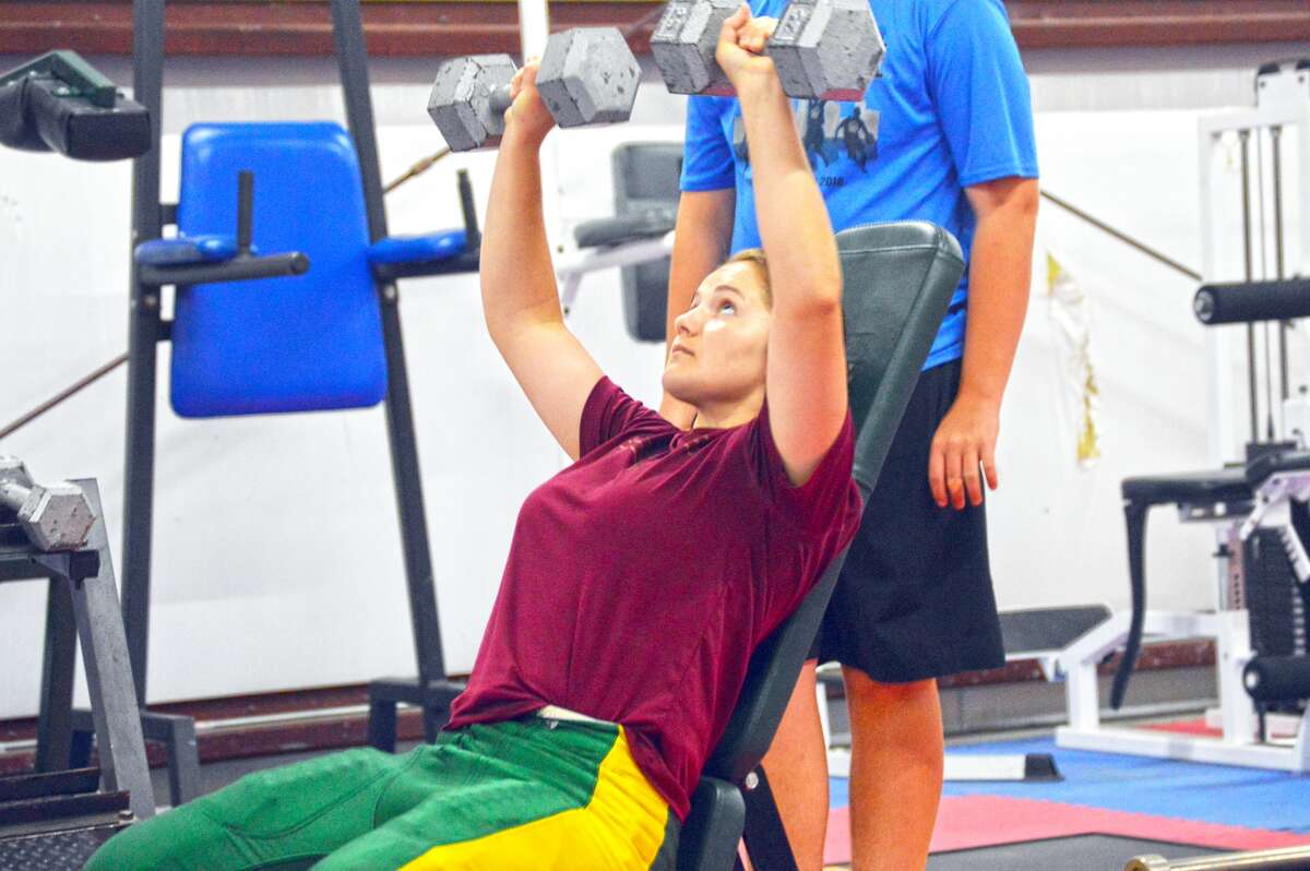 Skye Mayberry works out during a weights session for the Metro-East Lutheran football team at MELHS on Wednesday.
