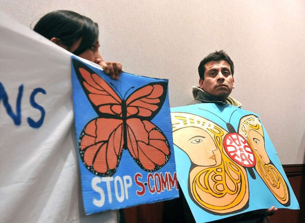 Hartford-- Jose Maria Islas (right), of New Haven, stands after testifying during a coalition meeting calling for a path to citizenship for undocumented immigrants at the state capitol. Islas is currently appealing deportation proceedings by the federal government. Photo-Peter Casolino 02/26/12