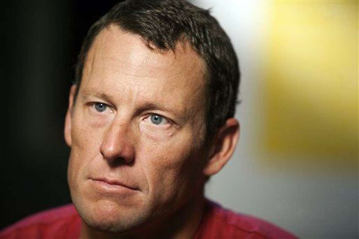 In this Feb. 15, 2011 file photo, Lance Armstrong pauses during an interview in Austin, Texas. The Justice Department laid out its case in a lawsuit against Lance Armstrong on Tuesday, Apriil 23, 2013 saying the cyclist violated his contract with the U.S. Postal Service and was "unjustly enriched" while cheating to win the Tour de France. (AP Photo/Thao Nguyen, File)