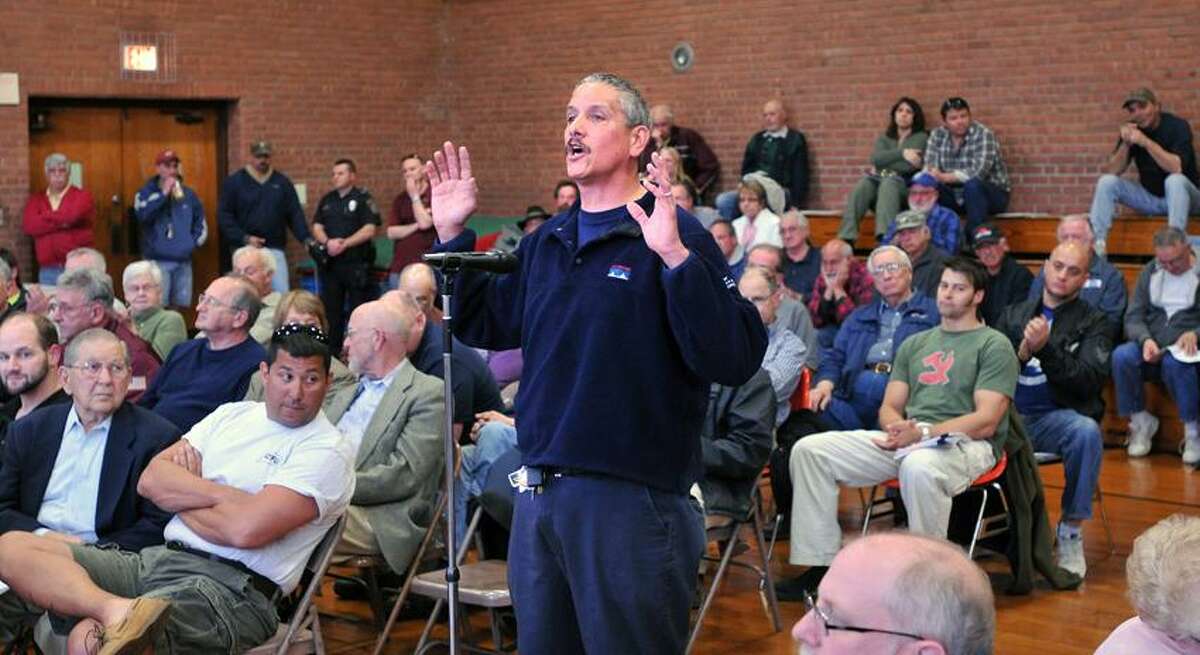 North Haven-- John Cinque of Branford had several questions for lawmakers during an informational meeting on the new gun laws at the North Haven Recreation Center. Cinque asked; "Would any of the new gun laws have stopped the Sandy Hook shootings?" Nearly all of the people who showed up at the meeting were angered by the new laws, that according to many, placed additional burdens on the law-abiding gun owner. Photo-Peter Casolino/Register pcasolino@newhavenregister.com