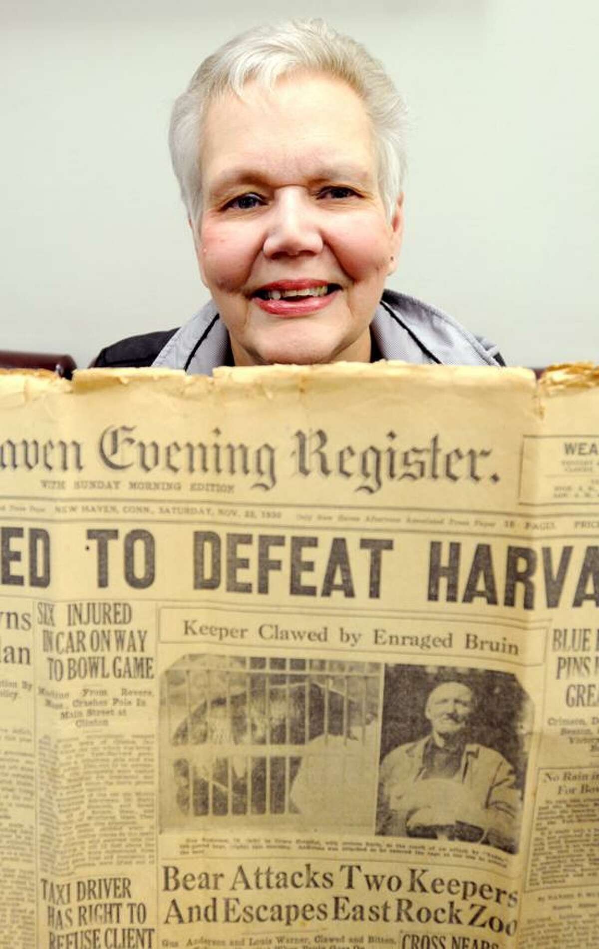 Donna Maturo, at the New Haven Register Wednesday, May, 15, 2013. Maturo is the great-granddaughter of Gustave Anderson, the caretaker who was killed by the a bear attack at East Rock Zoo in1930. Maturo holds the New Haven Evening Register newspaper that had the story on the front page on November 22, 1930. Photo by Peter Hvizdak / New Haven Register