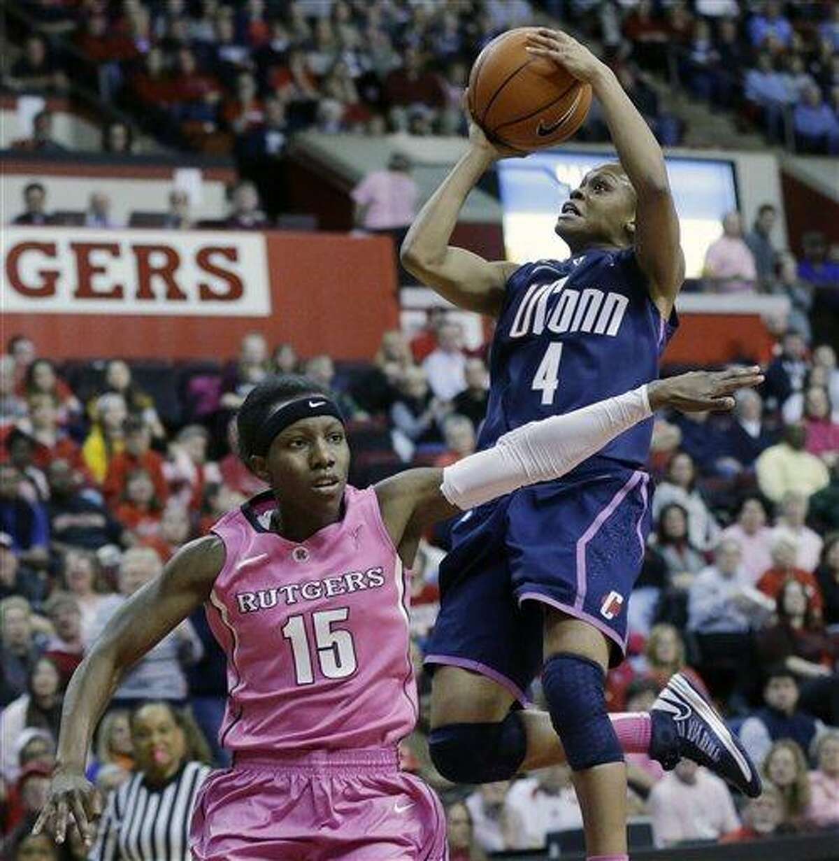 Connecticut's Moriah Jefferson (4) takes a shot over Rutgers' Syessence Davis (15) during the first half of an NCAA college basketball game Saturday, Feb. 16, 2013, in Piscataway, N.J. (AP Photo/Mel Evans)