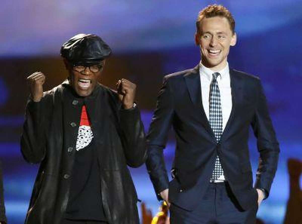 Actors Samuel L. Jackson (L) and Tom Hiddleston react as they accept the award for movie of the year for "The Avengers" at the 2013 MTV Movie Awards in Culver City, California April 14, 2013. REUTERS/Danny Moloshok (UNITED STATES Tags: Entertainment TPX IMAGES OF THE DAY) (MTV-SHOW)