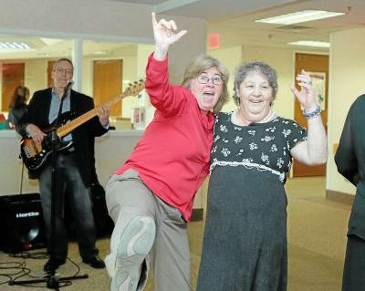SAndy Aldieri/Special to the Press Darlene Behr, a member of the Water's Edge staff, and resident Yvette Courtis dance at the facility's Senior Ball, one of the many events the center is hosting to celebrate National Nursing Home Week in Middletown.