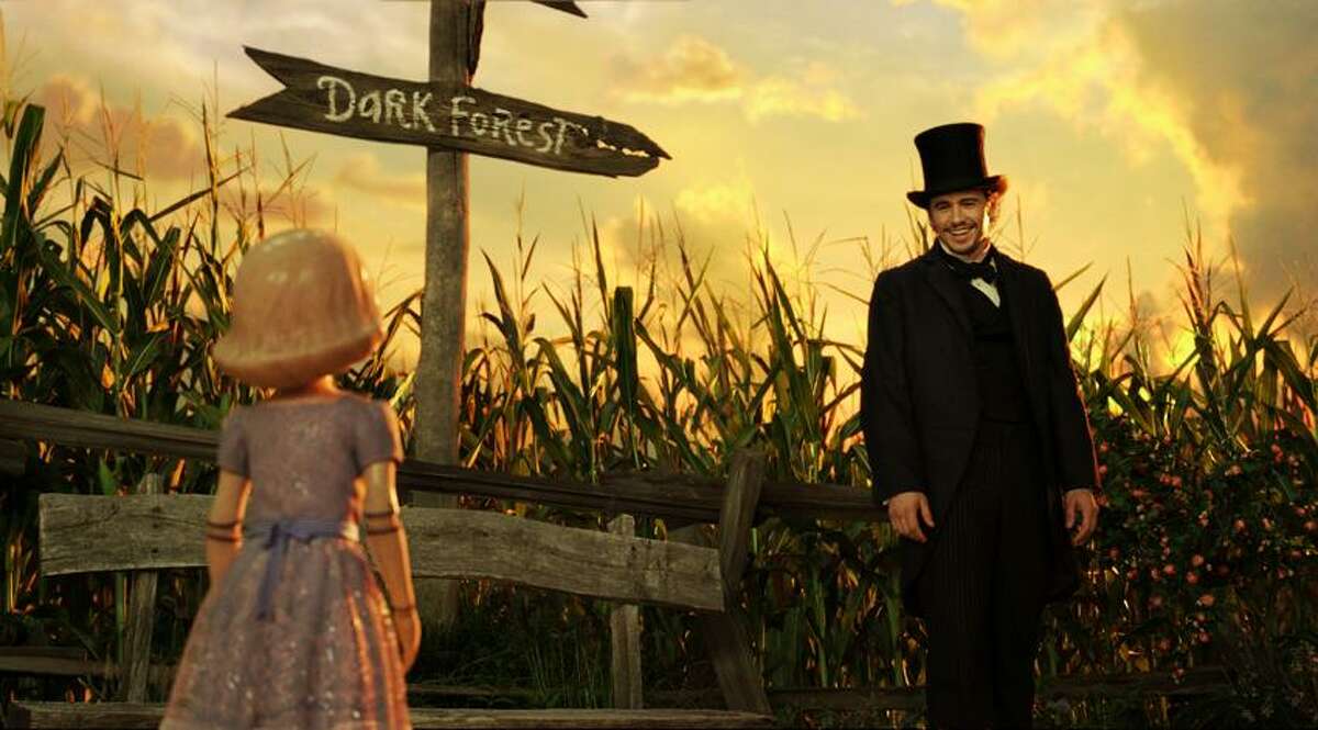 Disney Enterprises photo: Movie-making wizardry gives "Oz the Great and Powerful" its charm. That's China Girl, voiced by Joey King, and James Franco, as Oz.
