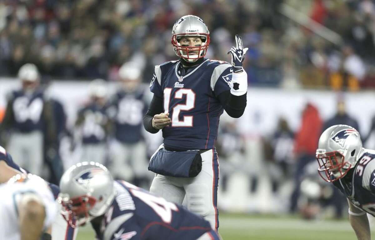 New England Patriots quarterback Tom Brady makes a call against the Miami Dolphins during the second quarter of an NFL football game in Foxborough, Mass., Sunday, Dec. 30, 2012. (AP Photo/Charles Krupa)