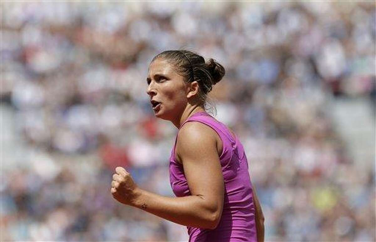 Italy's Sara Errani reacts as she plays Germany's Angelique Kerber in their quarterfinal match in the French Open tennis tournament at the Roland Garros stadium in Paris, Tuesday, June 5, 2012. Errani won 6-3, 7-6. (AP Photo/Bernat Armangue)