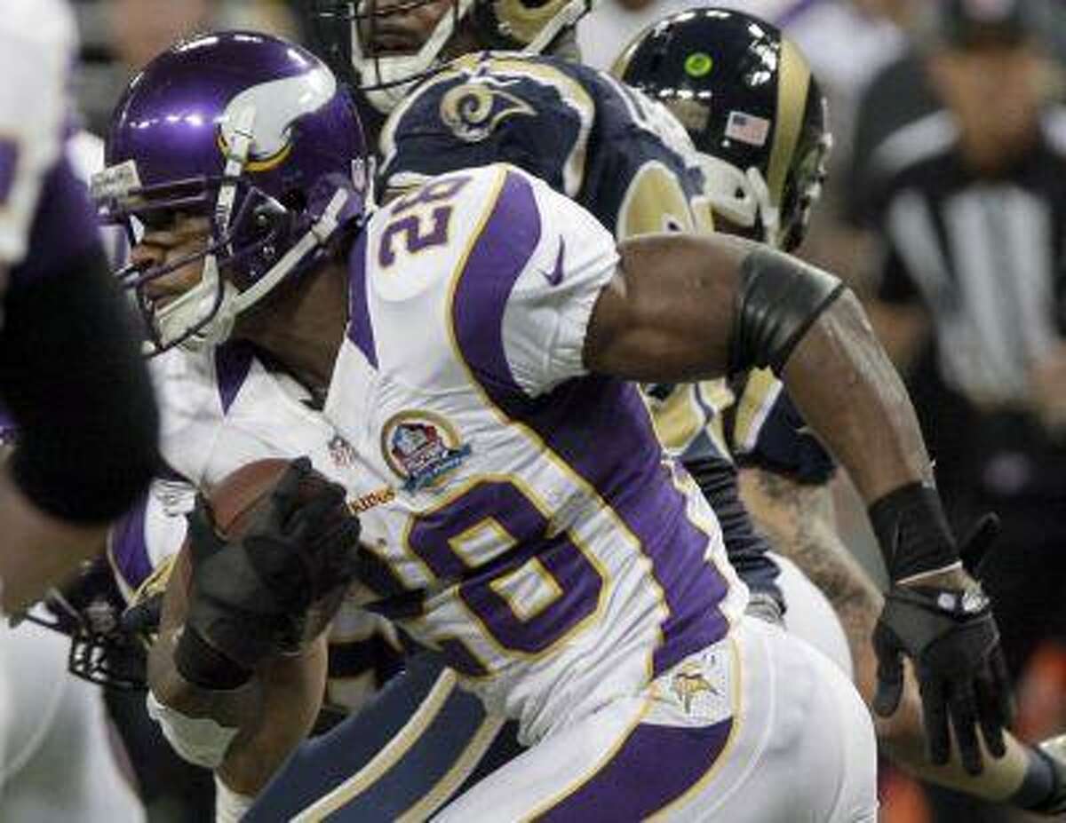 Minnesota Vikings running back Adrian Peterson (28) breaks free for an 82-yard touchdown run during the second quarter of an NFL football game against the St. Louis Rams Sunday, Dec. 16, 2012, in St. Louis.