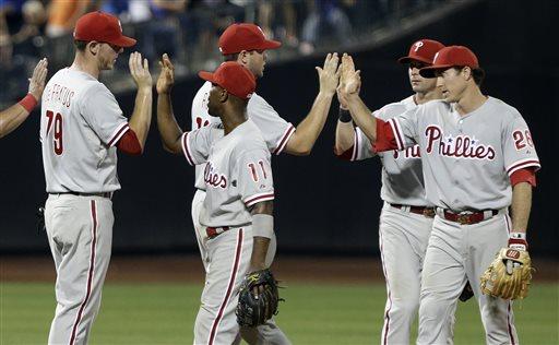 The Philadelphia Phillies' Chase Utley celebrates with Jimmy