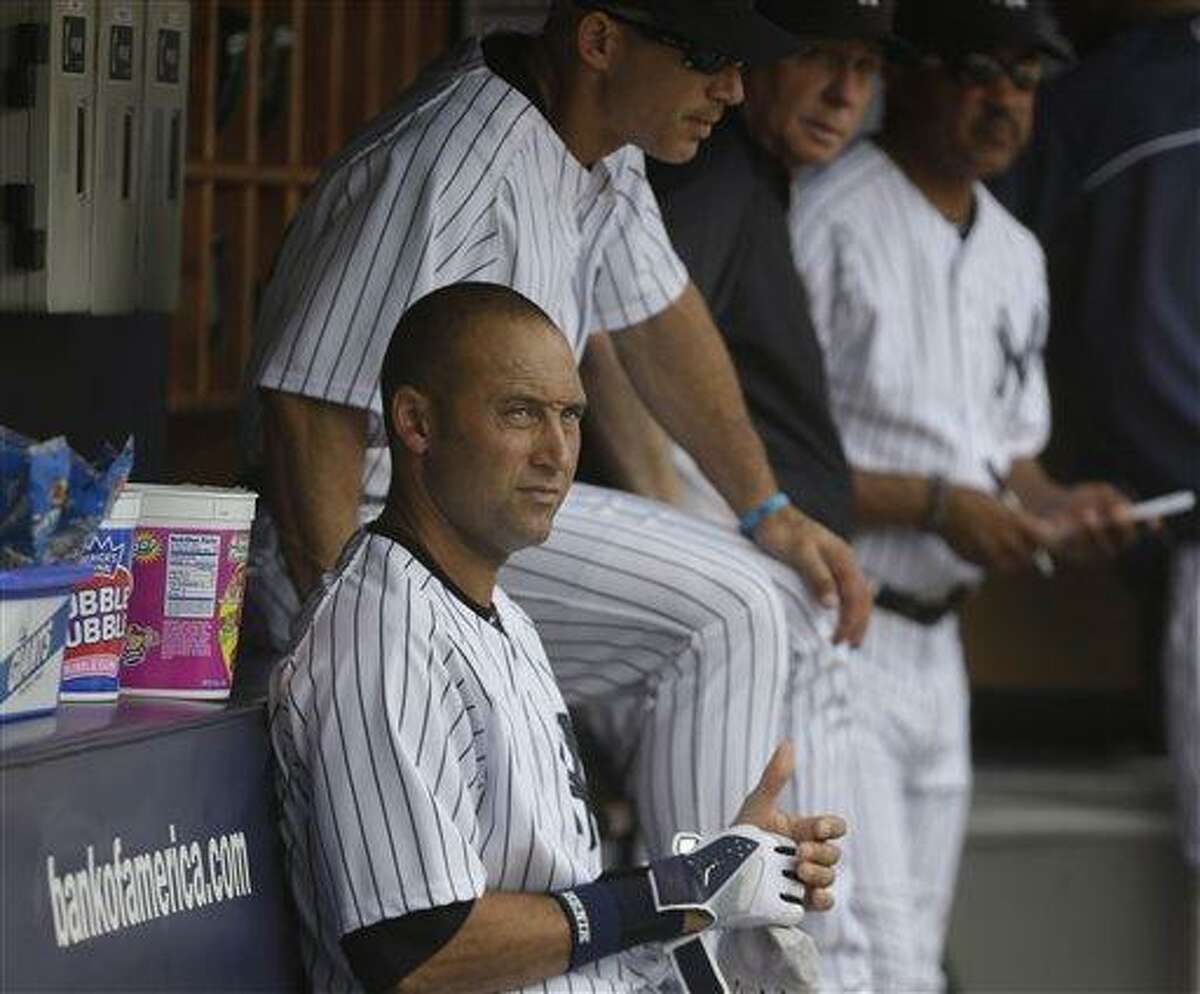 New York Yankees Derek Jeter and other Yankee players take the
