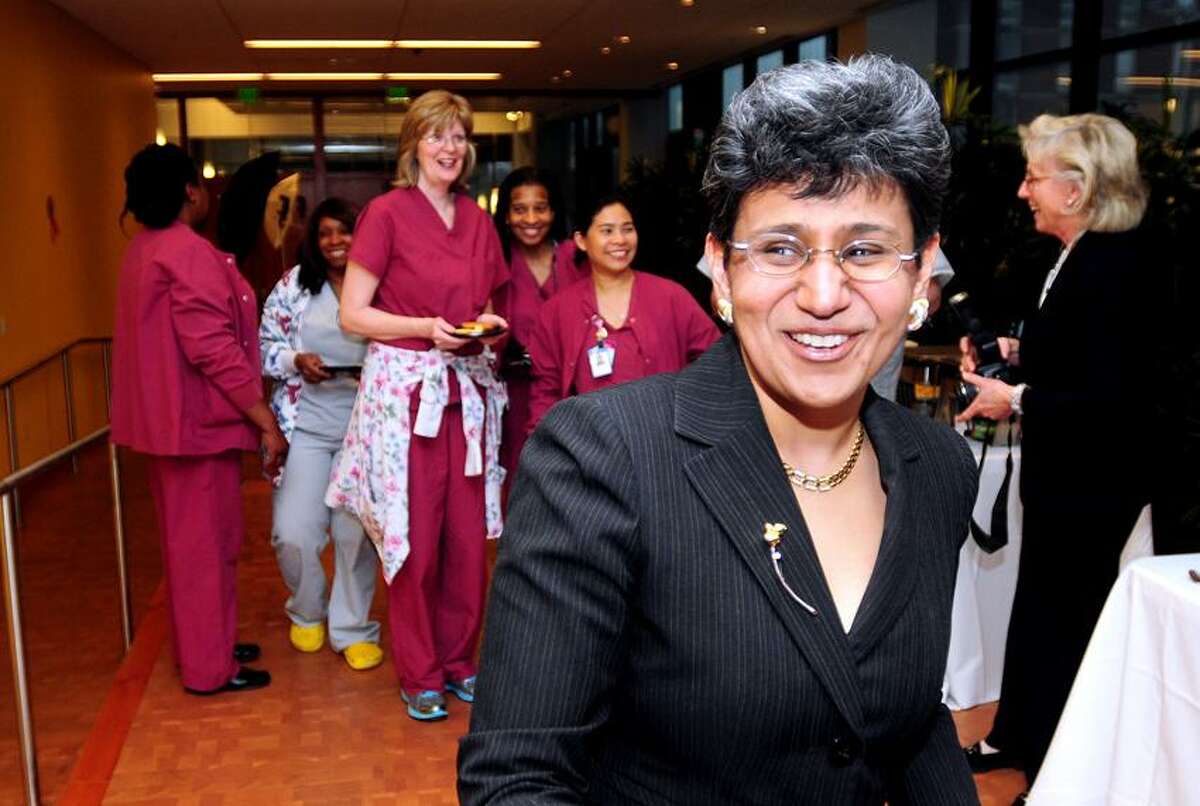Arnold Gold/Register photo: Dr. Anees Chagpar, front, director of the Breast Center at Smilow Cancer Center at Yale-New Haven Hospital, enters a reception celebrating the center's accreditation by the National Accreditation Program for Breast Centers. Joining her are nurses and surgical techs from Smilow.