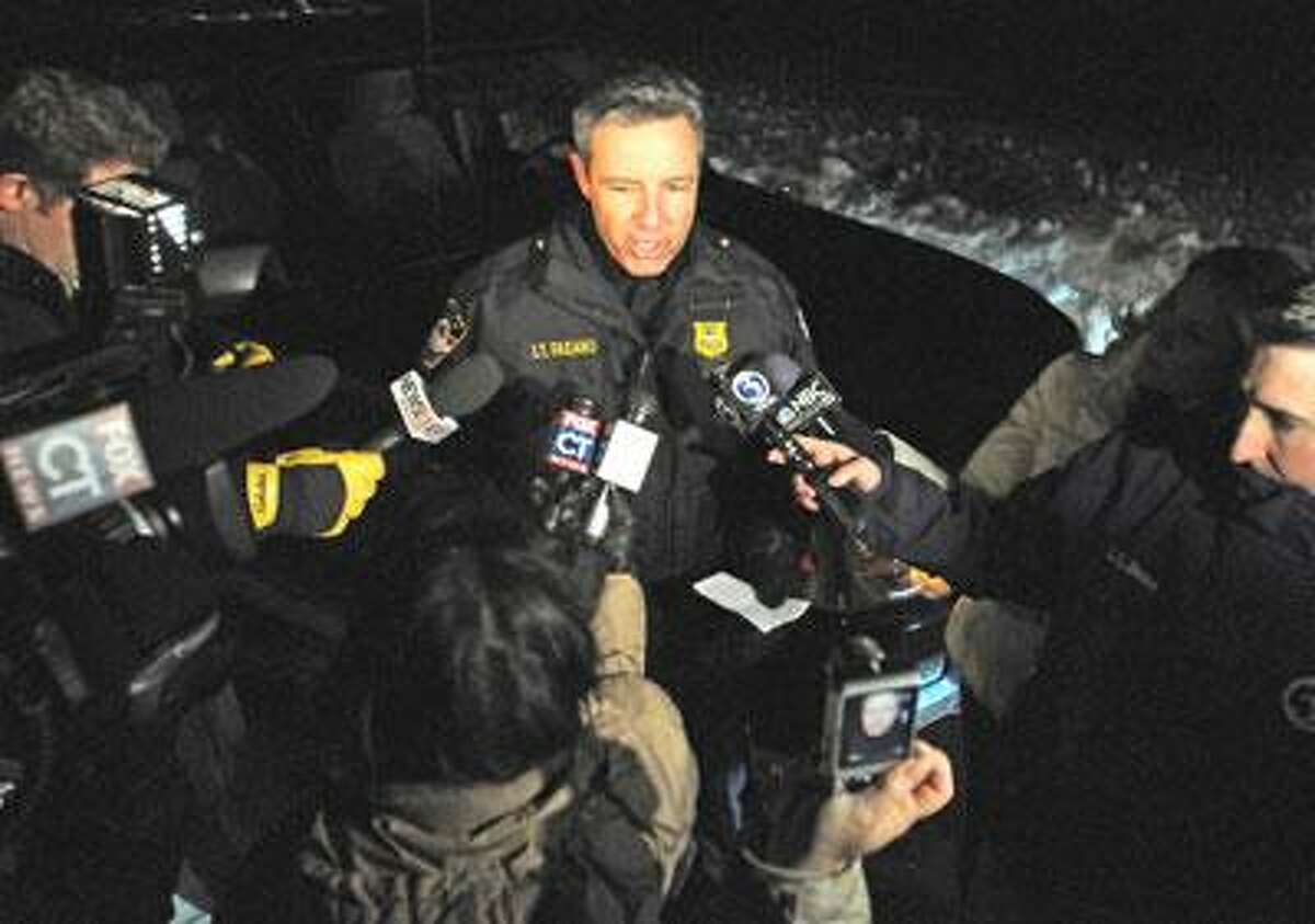 Cheshire Police Lt. Jim Fasano speaks to the media after the pilot of a single-engine plane origininating in New Bedford, MA was forced to make an emergency landing in Boulder Road in Cheshire. The plane was bound for Oxford, CT. (Photo by Brad Horrigan/New Haven Register)