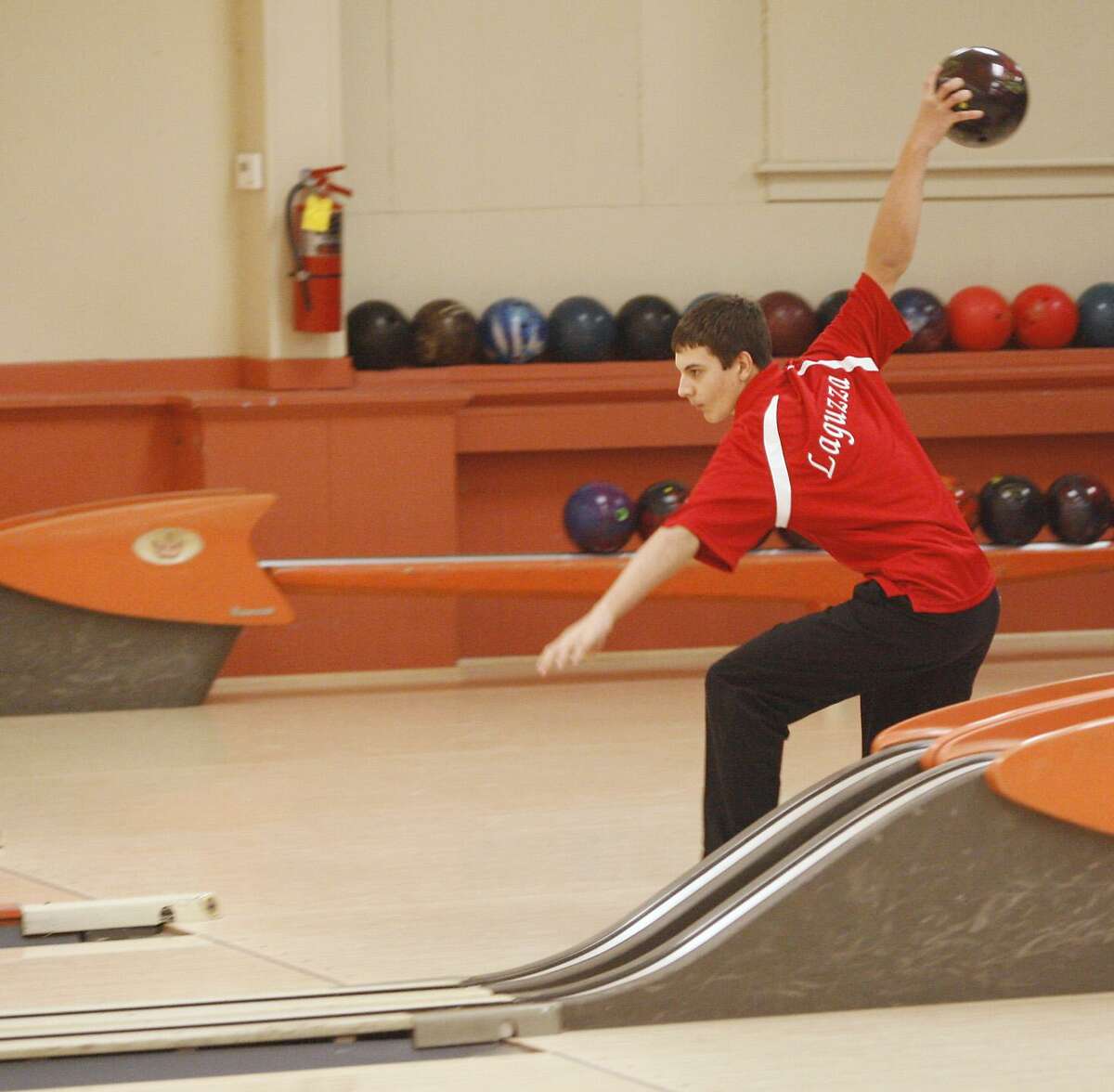 Dispatch Staff Photo by JOHN HAEGER VVS's Collin Laguzza sends the ball down the lane for a strike in the match against Canastota on Wednesday, Jan. 12, 2011 in Sherrill.