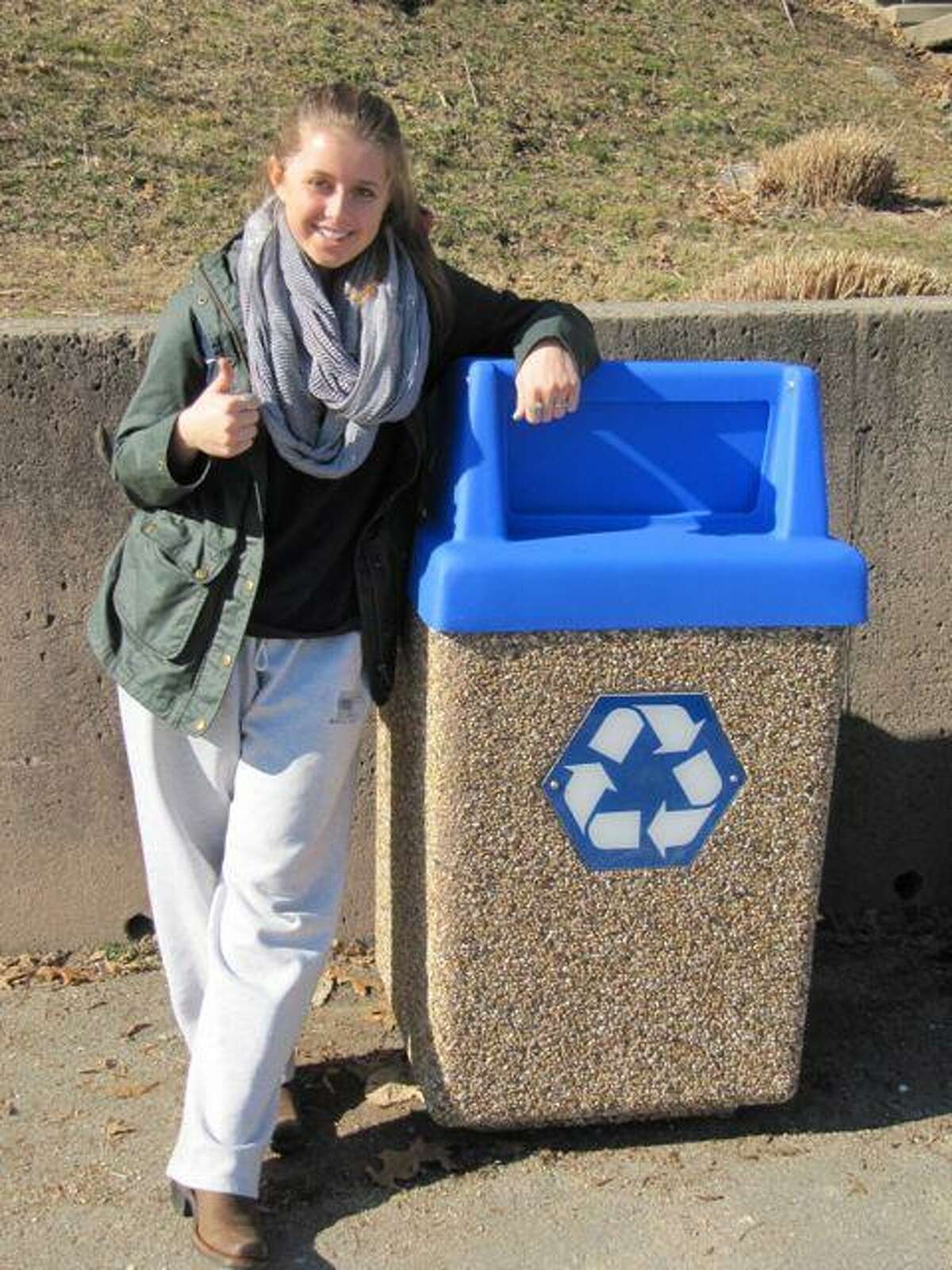 Hopkins student Sonia Lombroso with an outdoor recycling bin. Contributed photo.