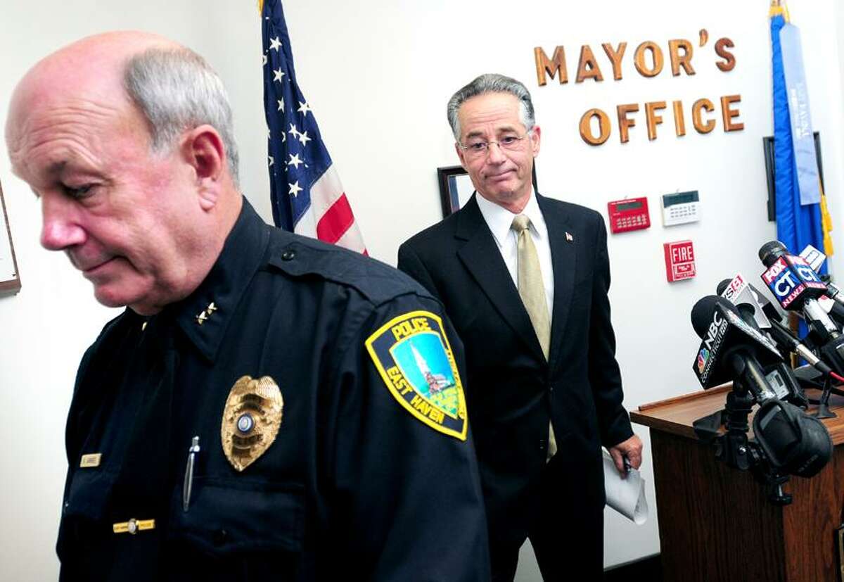 East Haven Police Chief Brett Larrabee (left) and East Haven Mayor Joseph Maturo, Jr., (right) leave a press after announcing a settlement agreement with the Department of Justice at East Haven Town Hall on 10/23/2012.Photo by Arnold Gold/New Haven Register AG0468B