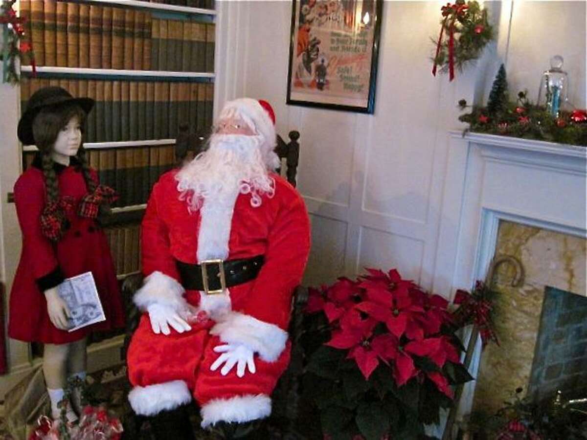 Mannequins representing a little girl and Santa Claus depict a scene from the 1947 movie classic, "Miracle on 34th Street," at the Osborne Homestead Museum in Derby. The house is decorated and open for tours during the holiday season. Patricia Villers/Register
