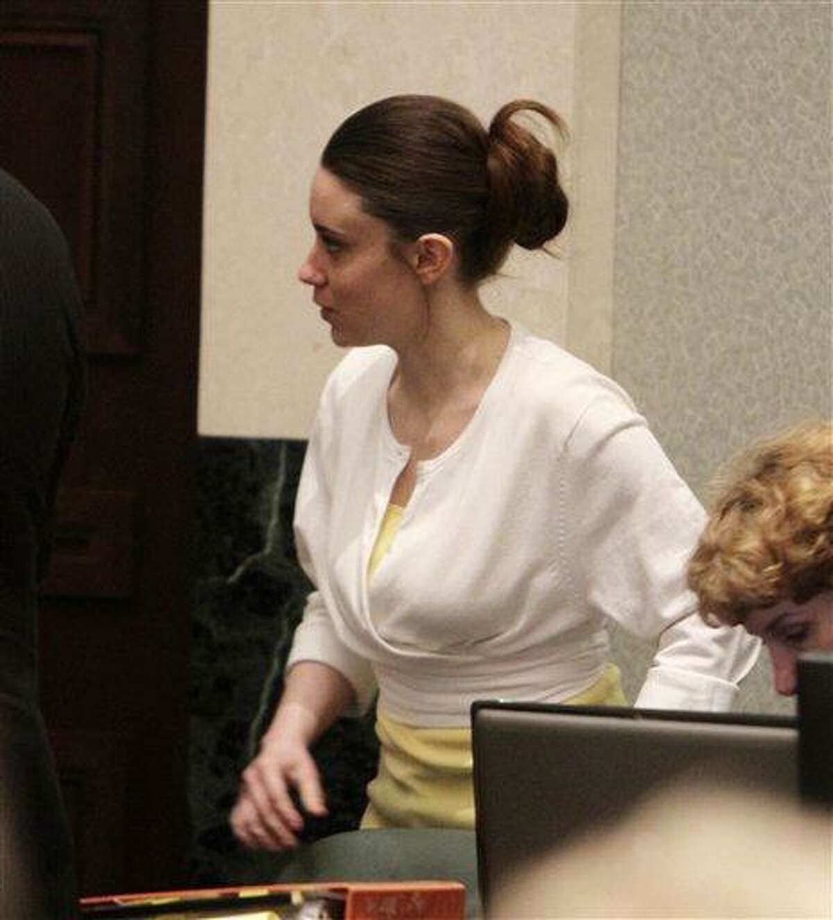 Casey Anthony enters the courtroom before the start of court in her murder trial at the Orange County Courthouse, Tuesday, June 28, 2011, in Orlando, Fla. Anthony, 25, is charged with killing her daughter Caylee in the summer of 2008. (AP Photo/Red Huber, Pool)