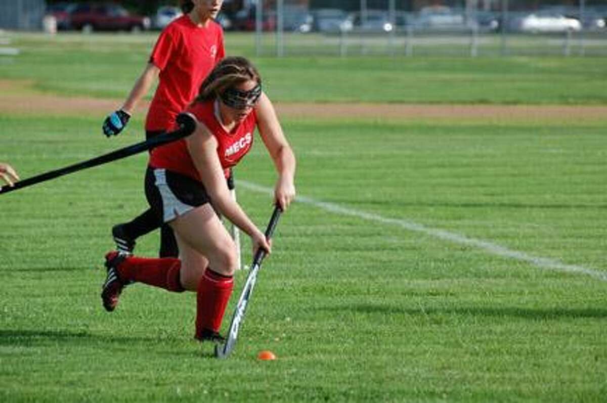 Submitted Photo by PENNY PATTERELLI Morrisville-Eaton's Kasey Holbert moves upfield during field hockey action in Canastota on June 27, 2011. The league is in its 22nd year, the 21st in Canastota.