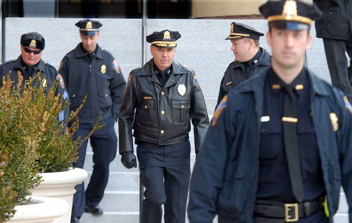 Shelton police officers including Chief Joel Hurliman center leave Derby Superior Court after the sentencing of Bruce Napik in the death of Shelton Sgt. Orville Smith. Photo by Mara Lavitt/New Haven Register