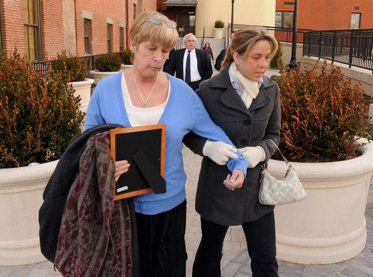 Shelton Sgt. Orville Smith's widow Nancy and her daughter Nicole Simpson leave Derby Superior Court after the sentencing of Bruce Napik in the death of Smith. Photo by Mara Lavitt/New Haven Register