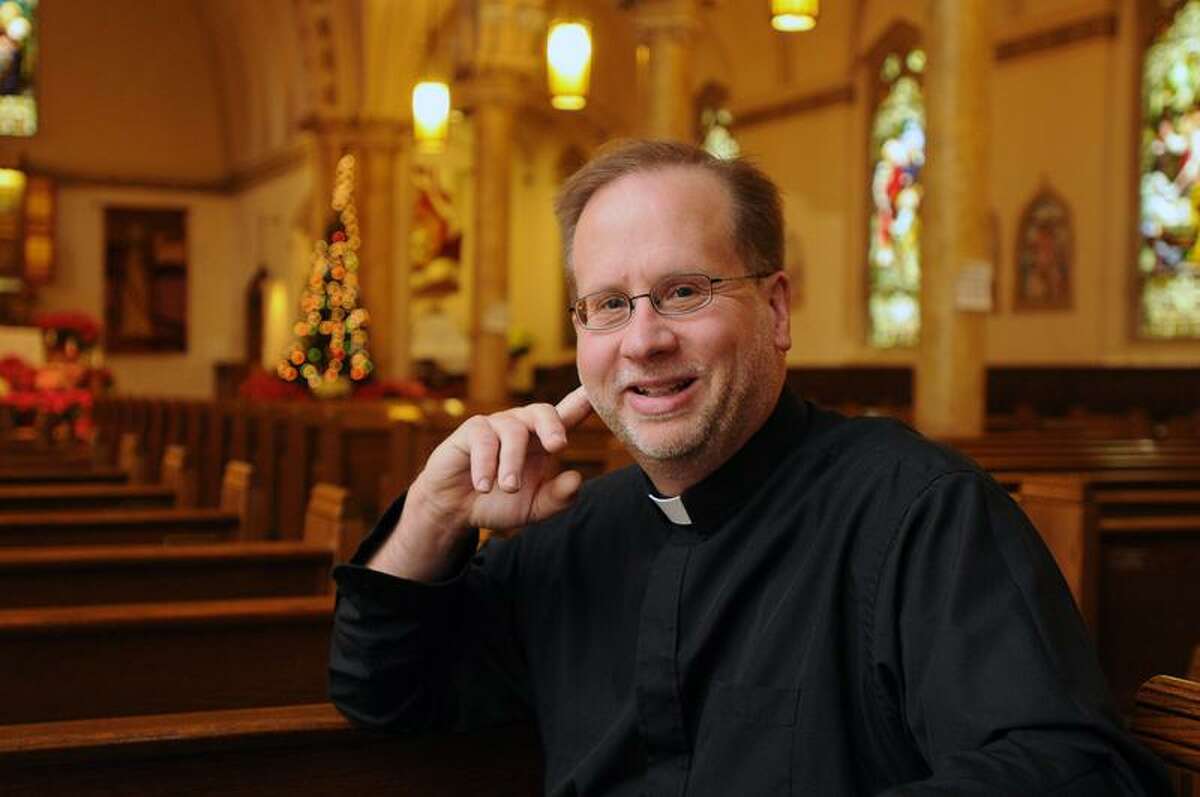 The Rev. James Manship of St. Rose of Lima church in Fair Haven is the New Haven Register's Person of the Year for 2011. (Peter Casolino/Register)