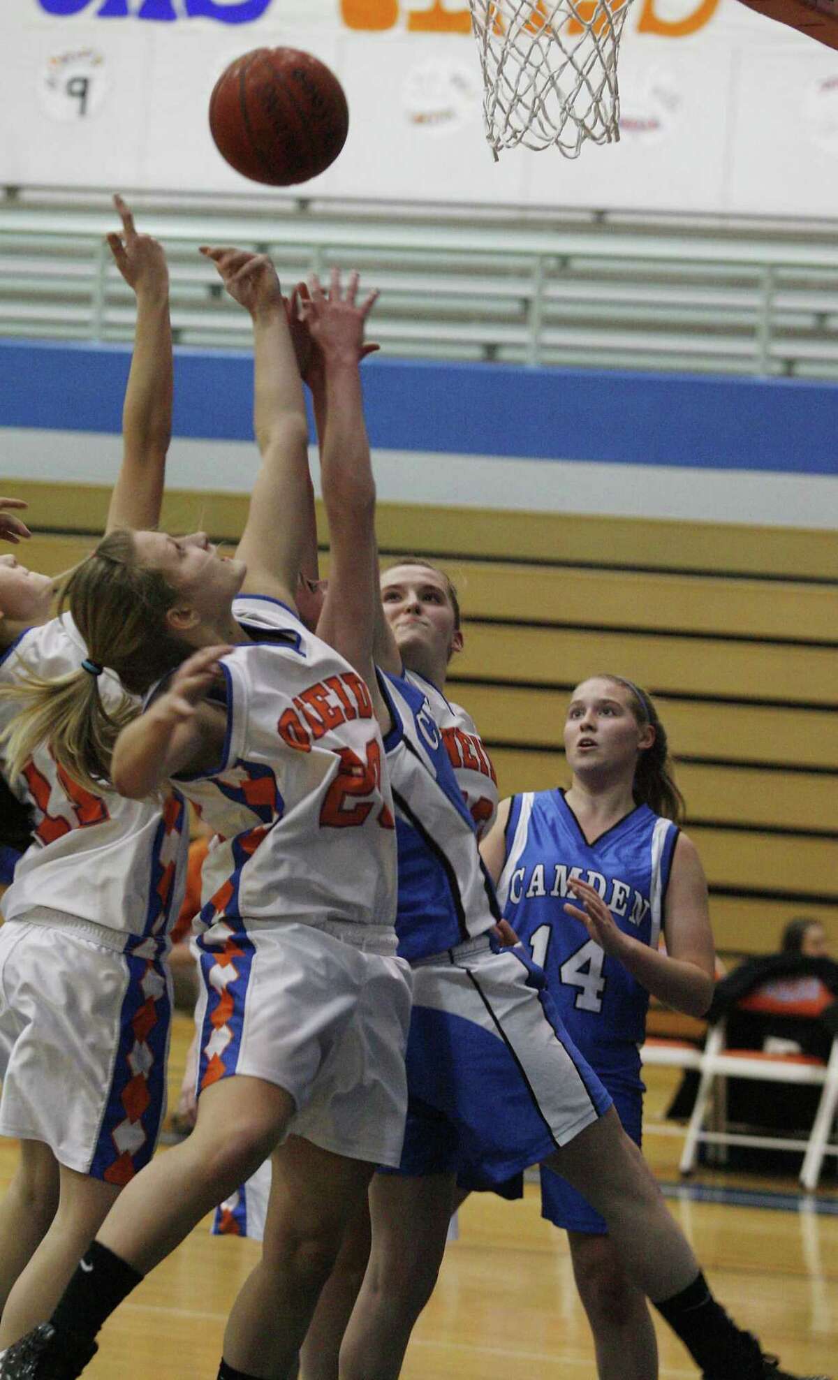Dispatch Staff Photo by JOHN HAEGER Oneida's Jackie Cavanagh (20) battles for the rebound in the frist half against Camden at Oneida on Friday, Feb. 11, 2011.