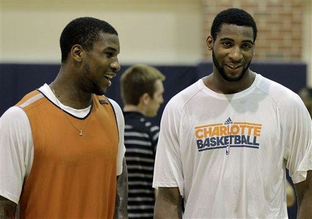 Thomas Robinson, left, talks with Andre Drummond, right, after working out for the Charlotte Bobcats in an NBA basketball practice in Charlotte, N.C., Friday, June 22, 2012. Robinson and Drummond are both possible NBA Draft picks on June 28. (AP Photo/Chuck Burton)