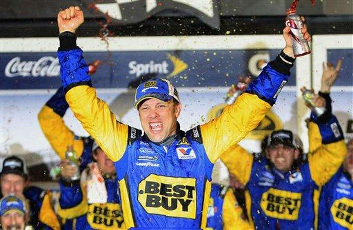 Matt Kenseth celebrates after winning the NASCAR Daytona 500 Sprint Cup series auto race at Daytona International Speedway in Daytona Beach, Fla., early Tuesday, Feb. 28, 2012. (AP Photo/John Raoux)