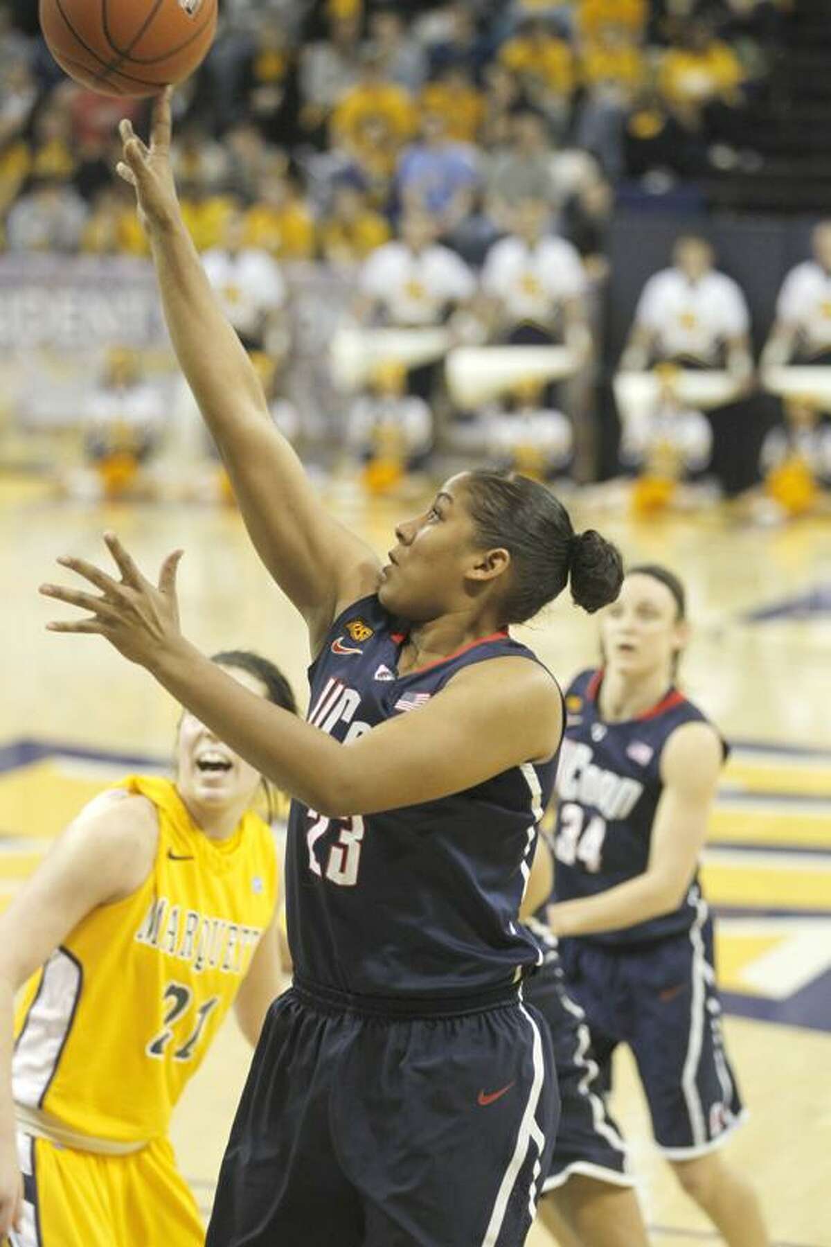 Connecticut's Kaleena Mosqueda-Lewis(23) puts up a shot against Marquette in the first half of an NCAA college basketball game Saturday, Feb. 25, 2012, in Milwaukee. (AP Photo/Jeffrey Phelps)