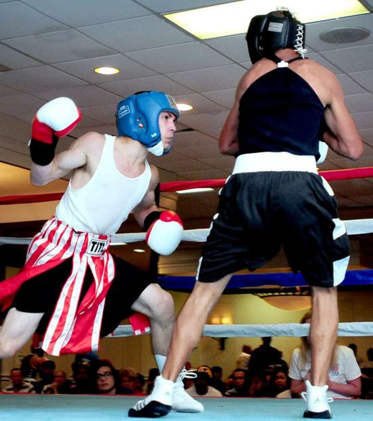 Luis Rosa (left) fights Eliza Peizoto in the Dave Solomon Fresh Air Fights in North Haven on 6/16/2012.Photo by Arnold Gold/New Haven Register AG0453C
