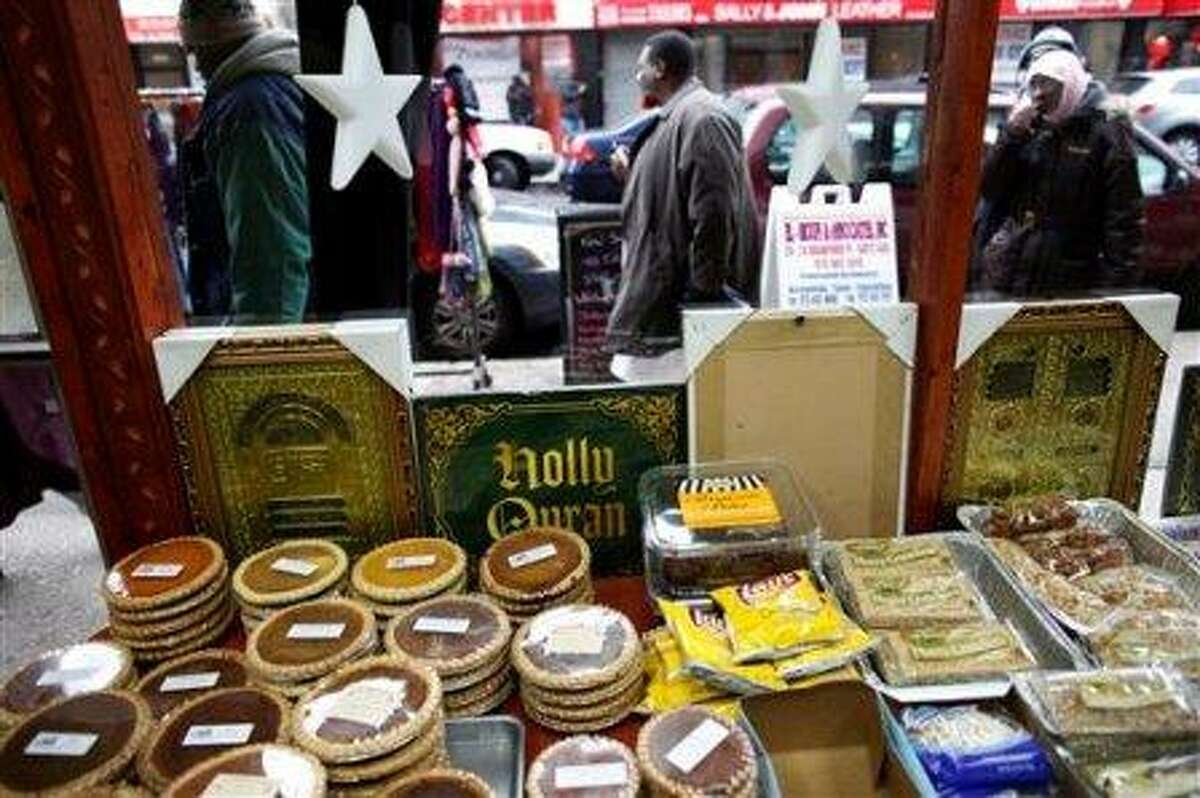 An assortment of halal foods and religious items are seen from inside Abdul Kareem Abdullah's cafe, as he is interviewed by the Associated Press regarding New York Police Department surveillance of the Muslim community in Newark, N.J., Wednesday, Feb. 15, 2012. Americans in New Jersey's largest city were subjected to surveillance as part of the New York Police Department's effort to build databases of where Muslims work, shop and pray. The operation in Newark was so secretive, even the city's mayor says he was kept in the dark. For months in mid-2007, plainclothes NYPD officers snapped pictures of mosques and eavesdropped in Muslim neighborhoods. The result was a 60-page report, obtained by The Associated Press. It cited no evidence of crimes. It was just a guide to Newark's Muslims. (AP Photo/Charles Dharapak)