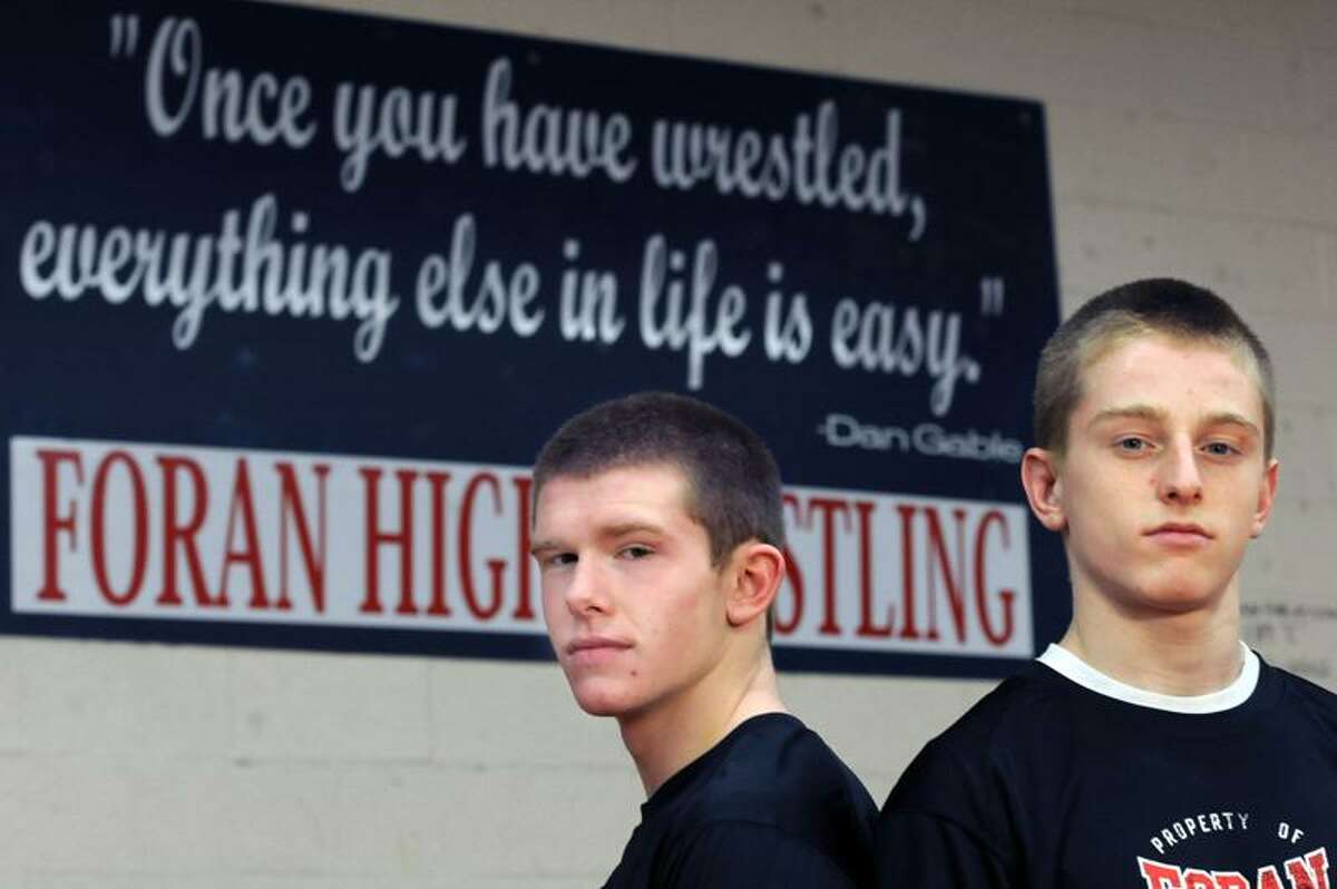 Foran High School (Milford) wrestlers Clay Callahan left and Carl Luth right. Photo by Mara Lavitt/New Haven Register2/22/12