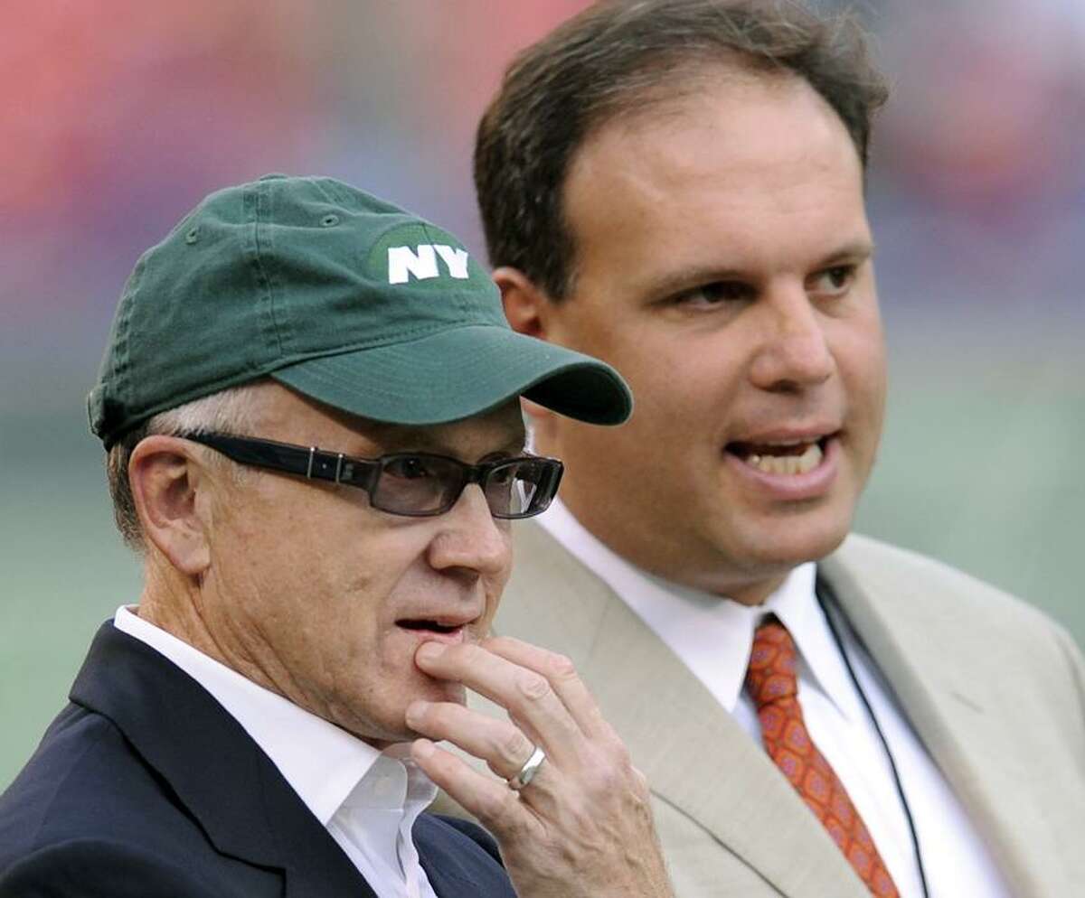 New York Jets general manager Mike Tannenbaum, right, pictured here with New York Jets Chairman and CEO Woody Johnson, was fired Monday. Head coach Rex Ryan will return next season.