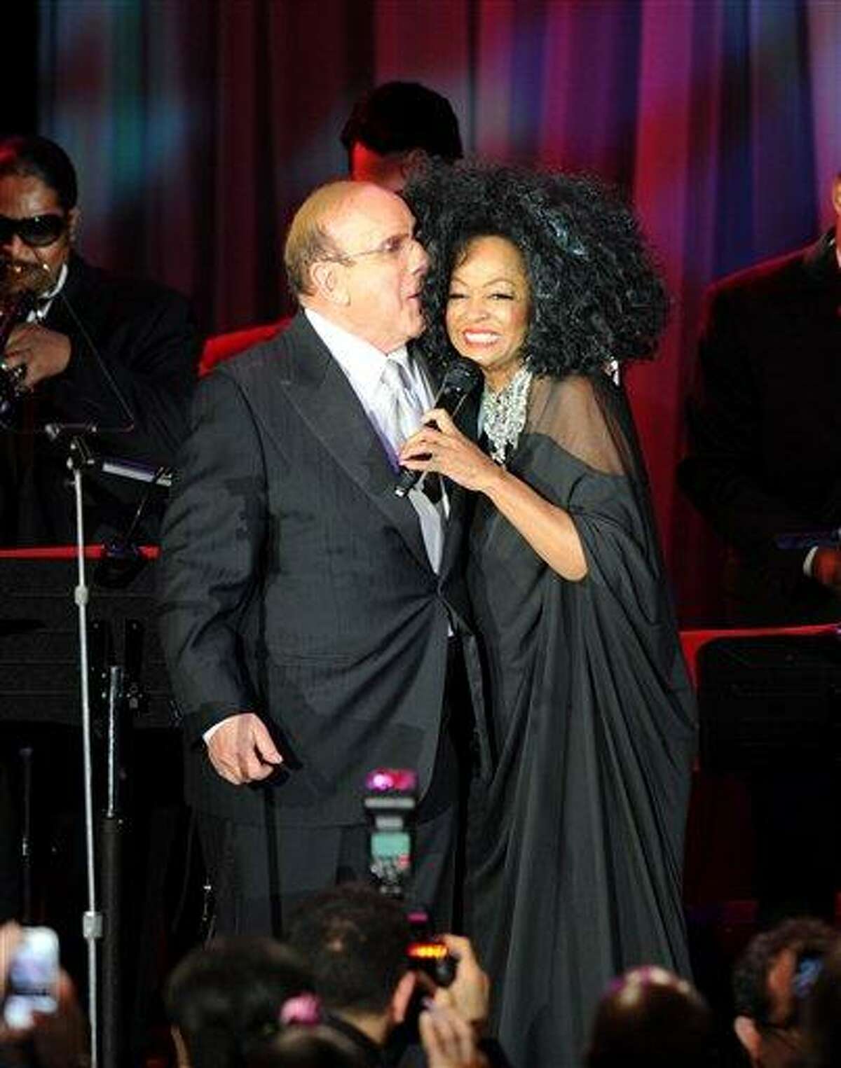 Clive Davis and Diana Ross speak onstage at the Pre-GRAMMY Gala & Salute to Industry Icons with Clive Davis honoring Richard Branson, Saturday in Beverly Hills, Calif. Associated Press