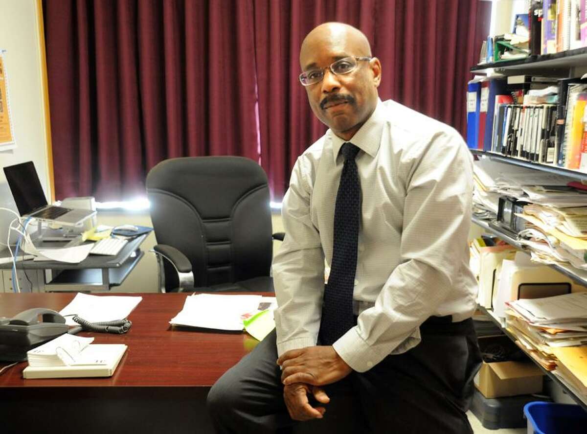 SCSU Professor Frank Harris, who wrote a book about names that have been used to describe blacks, in his office. VM Williams/Register