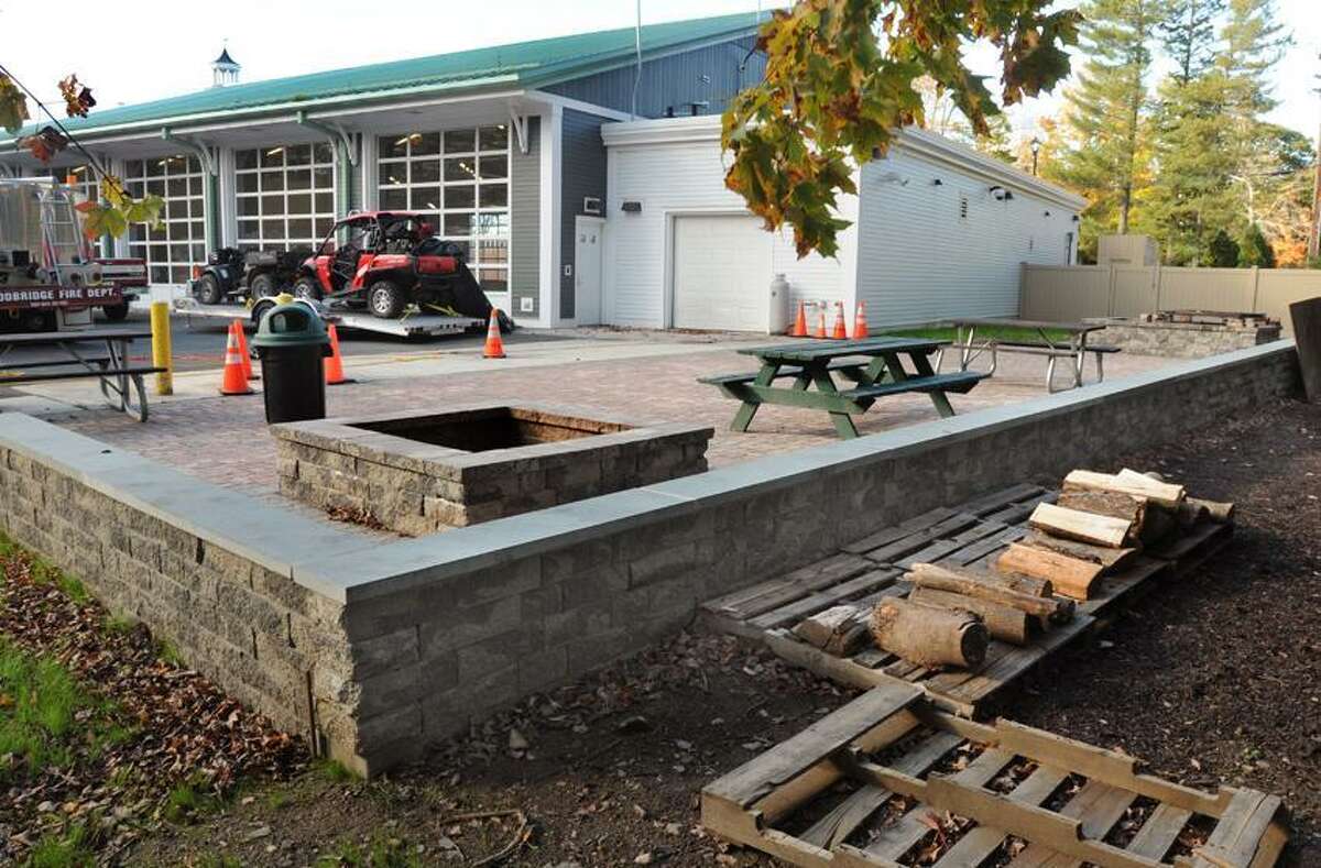 The Woodbridge Fire Department has been cited by the Inland Wetlands Commission for the construction of fire pits, a paver area, and a fence. Mara Lavitt/New Haven Register