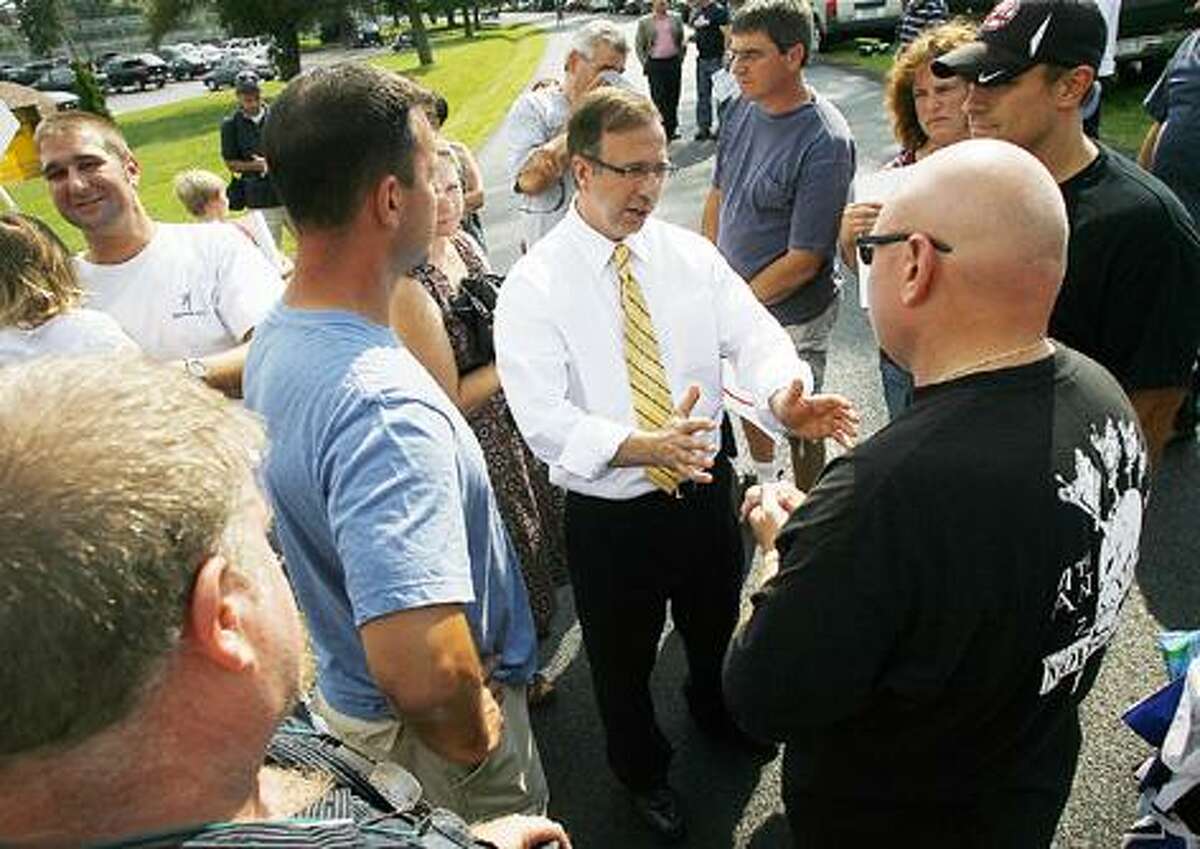 Photo by JOHN HAEGER (Twitter.com/OneidaPhoto) N.Y. State Sentor Joe Griffo, R-47, talks with supporters rallying outside of Oneida Correctional Center in Rome on Wednesday, July 6, 2011, to try and keep the prison from closing.