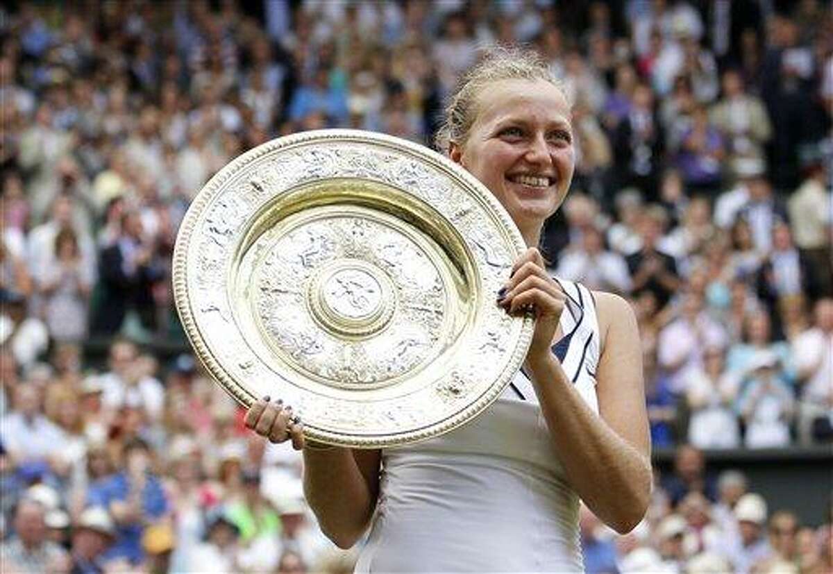 Petra Kvitova of the Czech Republic holds her trophy after defeating Russia's Maria Sharapova in the ladies' singles final at the All England Lawn Tennis Championships at Wimbledon, Saturday, July 2, 2011. (AP Photo/Anja Niedringhaus)
