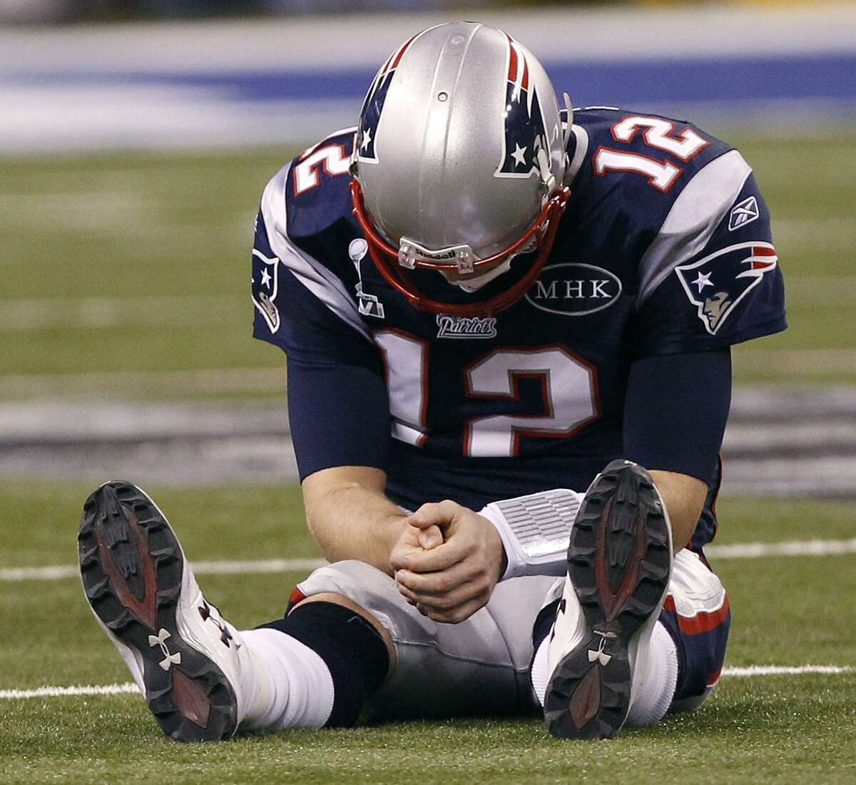 Good sport Tom Brady signs intercepted ball that was his final pass as a  Patriot