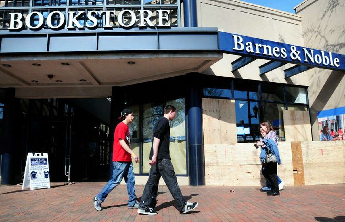 People walk by part of the Barnes & Noble at Yale under construction on Broadway in New Haven Monday. Rumor is, Apple is planning to open a store next to the bookstore. (Arnold Gold/Register)