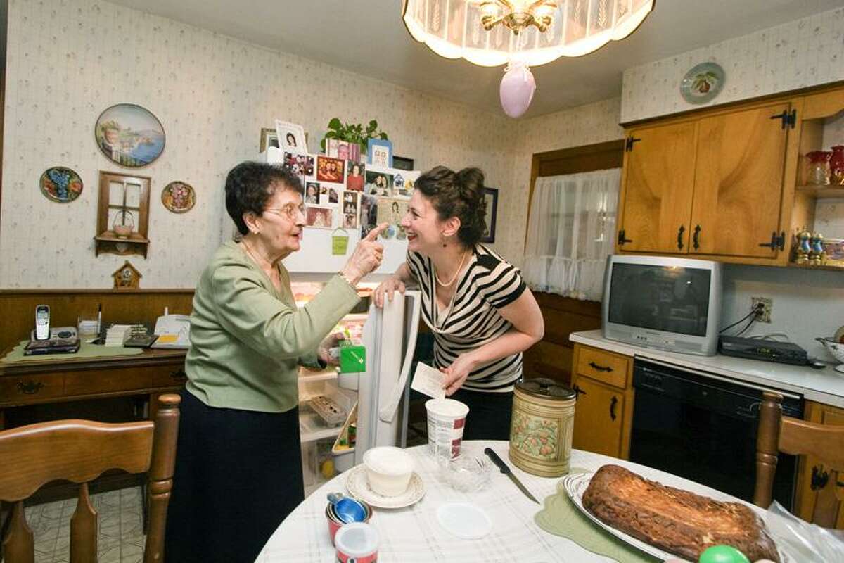 Charlene Ribera Photography photos: Theresa Argento, 88, and Jocelyn Ruggiero in Argento's kitchen in New Haven. They got together recently to make Easter ham pie.