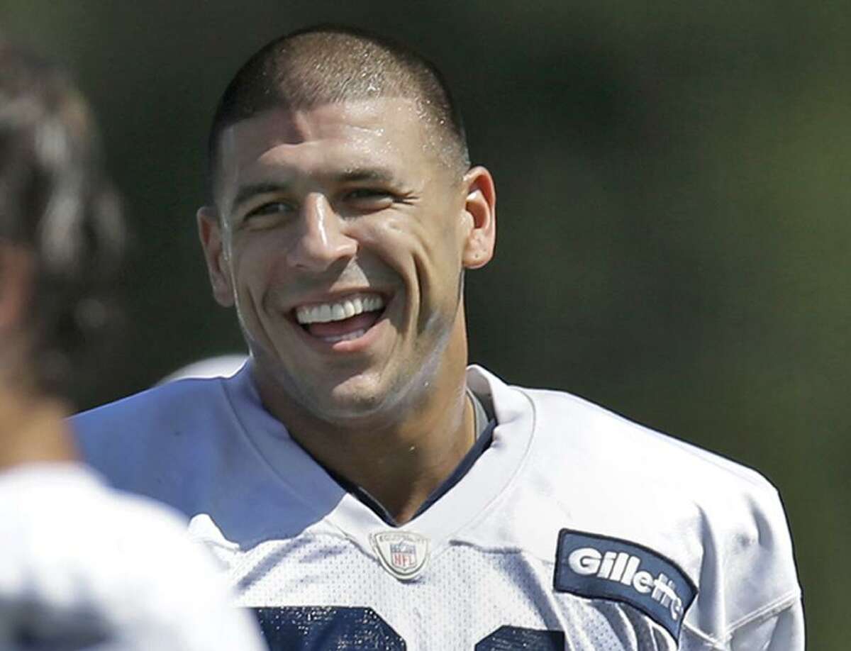 New England Patriots tight end Aaron Hernandez laughs at team practice in Foxborough, Mass. Monday, Aug. 27, 2012. The Patriots are preparing for their final pre-season football game against the New York Giants on Wednesday. (AP Photo/Elise Amendola)