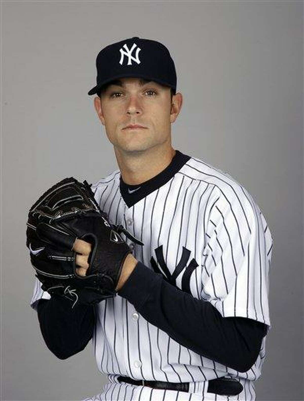 FILE - This Feb. 27, 2012 file photo shows New York Yankees baseball player David Robertson. The Yankees took their first misstep of 2012 when All-Star setup man David Robertson sprained his right foot when he fell down stairs while moving boxes in his spring training home. An initial X-ray was negative, and the reliever was taken a hospital for an MRI Thursday, March 8, 2012. (AP Photo/Matt Slocum, File)