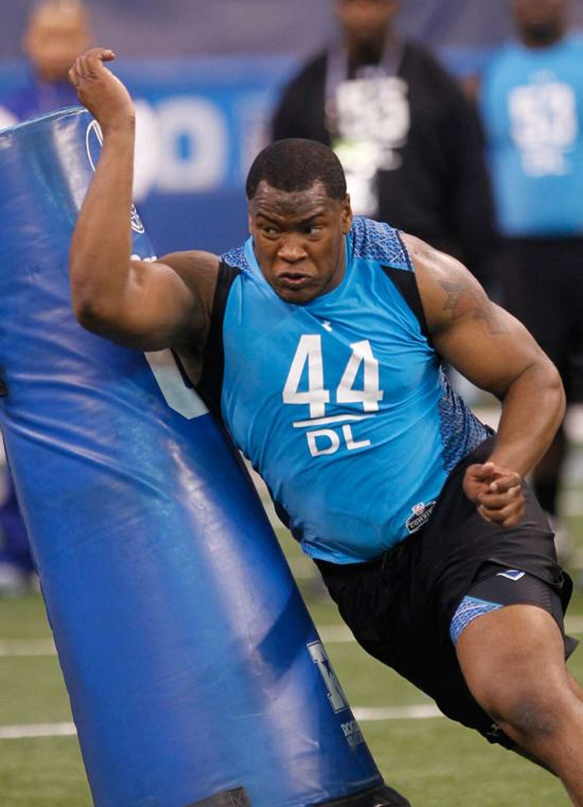 In this Feb. 27 file photo, UConn defensive tackle Kendall Reyes runs a drill at the NFL Combine in Indianapolis. Reyes was picked by the San Diego Chargers in the second round of the draft on Friday. (AP Photo/Dave Martin)
