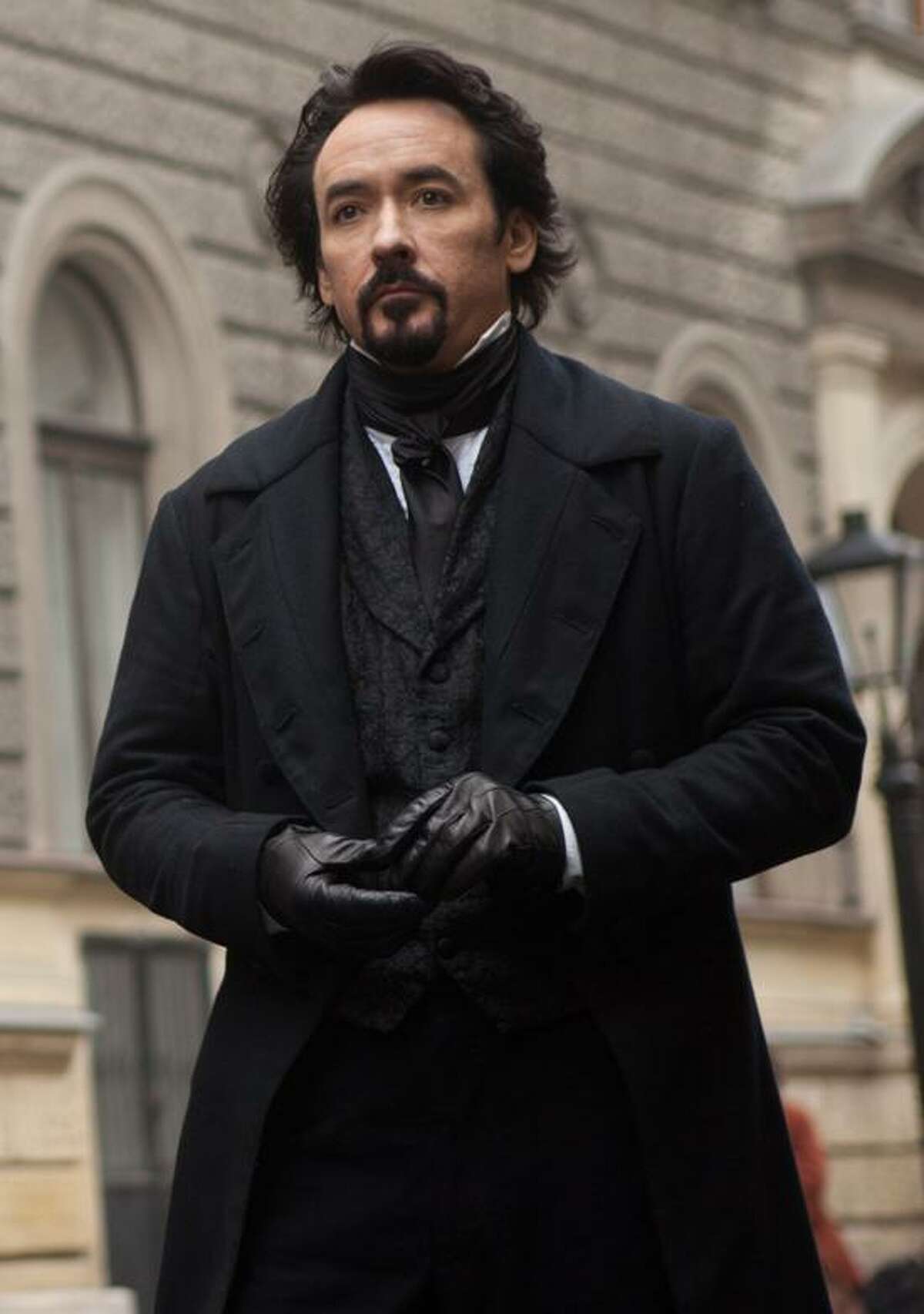 Larry Horricks/Relativity Media photo: John Cusack portrays Edgar Allan Poe in the gothic thriller "The Raven."