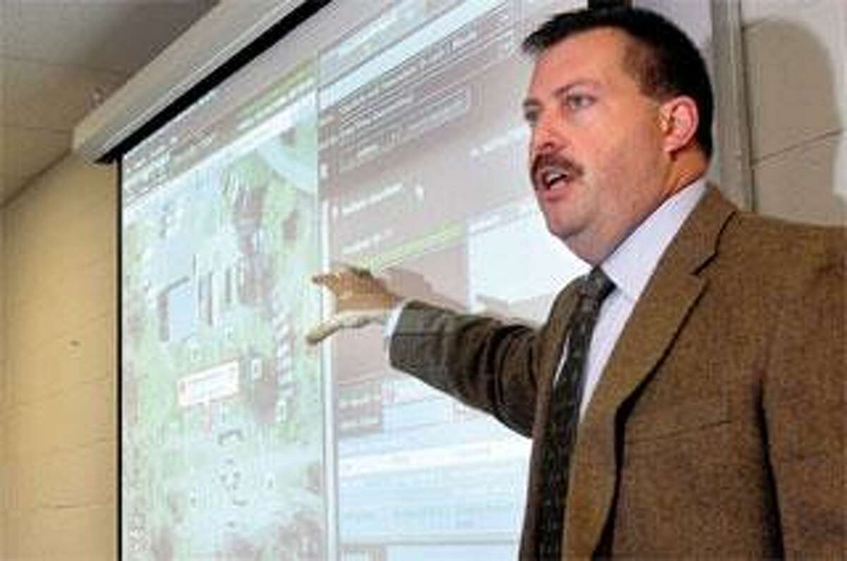Assistant Police Chief Peter Reichard presents a demonstration Friday showing how the department is using ShotSpotter technology in the city. (Brad Horrigan/Register)