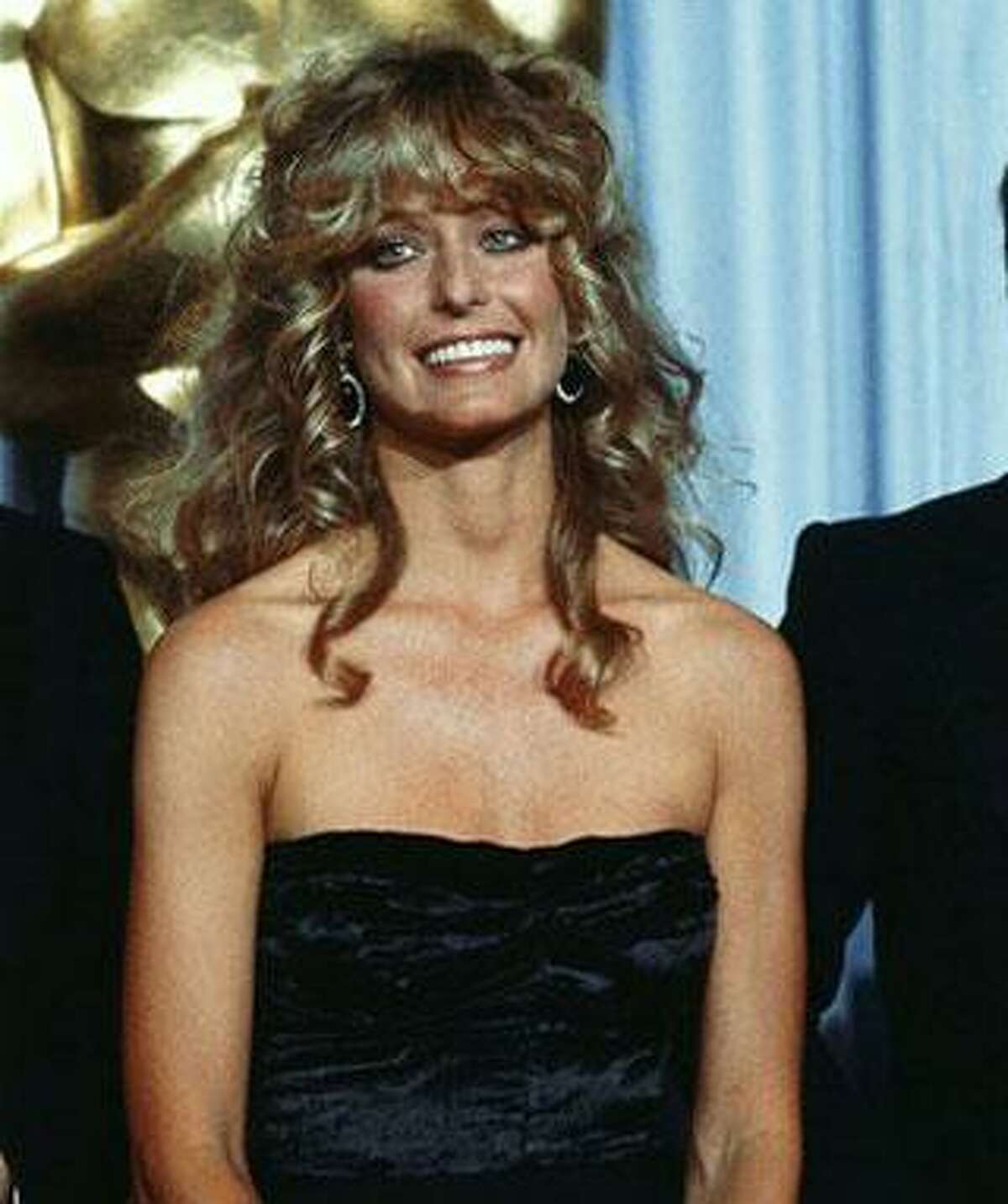 In this April 14, 1980 file photo, actress Farrah Fawcett-Majors is shown at Academy Awards Presentations in Los Angeles.Fawcett died Thursday, June 25, 2009 in a Los Angeles hospital. She was 62. (AP Photo/Reed Saxon, file)