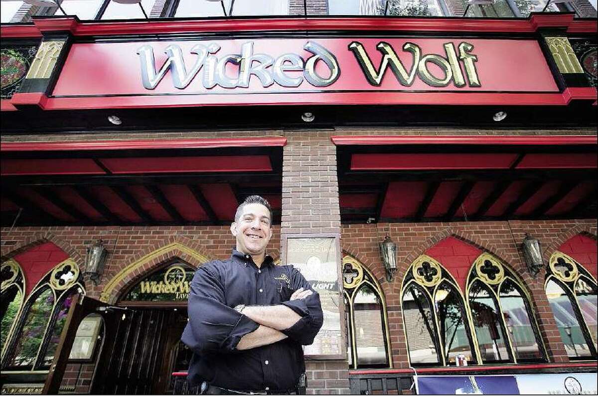Peter Casolino/Register General Manager Stephen Deierlein stands in front of Wicked Wolf Tavern at 144 Temple St., formerly Playwright Irish Pub.