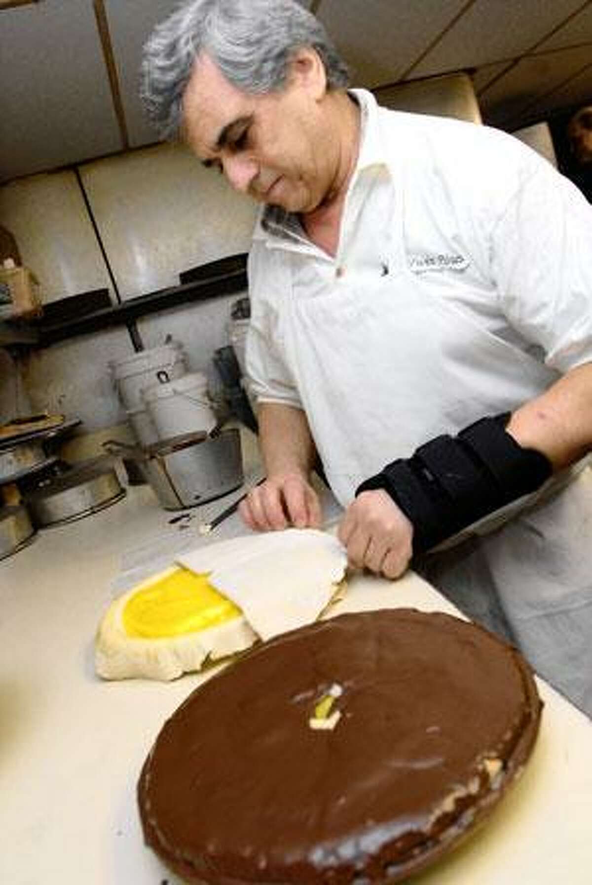 Mike Polsakis of Twin Pines Diner in East Haven prepares Lemon Chocolate Pie. (Brad Horrigan/Register)