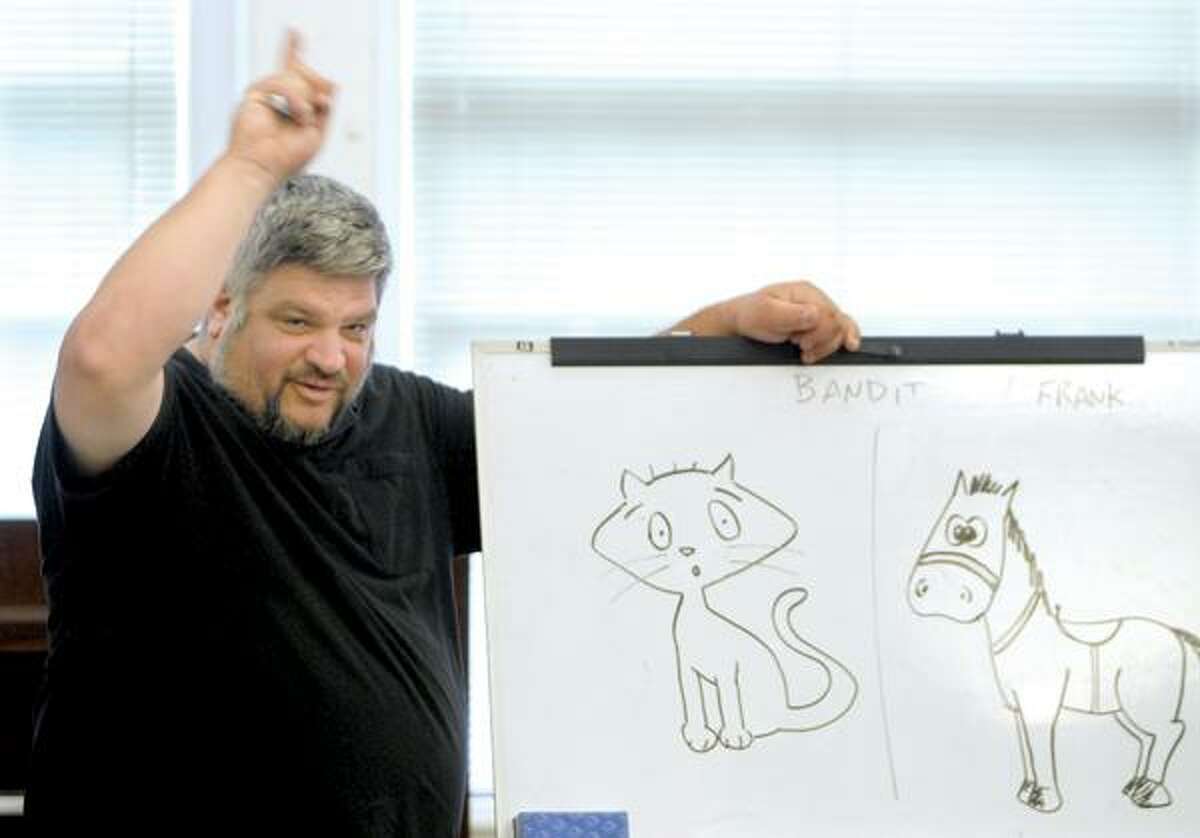 Valley Arts Council director Richard DiCarlo leads the comic strip class.